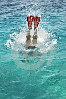 Man diving under water