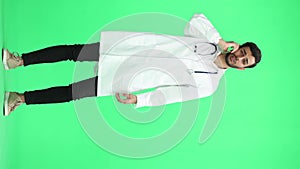 A man doctor conversate with phone on a green background