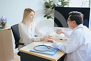 Man doctor examining to woman patient,Infertility counseling and suggestion using new technology,Physician giving a consultation a