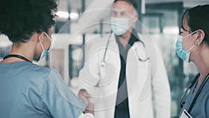 Man, doctor and handshake with mask for meeting, greeting or teamwork together at hospital. Group of medical employees