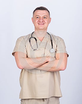 Man doctor with stethoscope physician uniform. Medicine and health care. Professional doctor. Experienced doctor beige