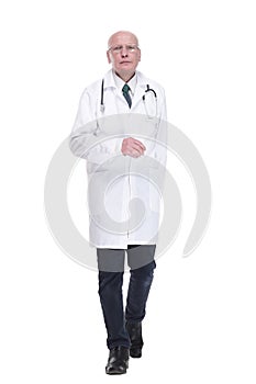 man doctor striding forward confidently . isolated on a white background.