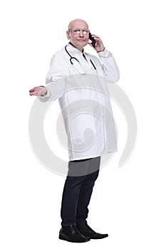 man doctor talking on a mobile phone. isolated on a white background.