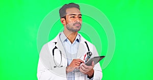 Man, doctor and thinking with tablet, green screen in studio background for cardiology with indian. Service, male
