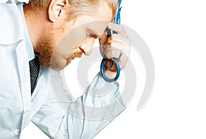 Man Doctor Thinking And Tired. Doctor Is Considering Diagnosis. Patient Care Concept On Isolated Background photo