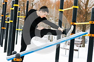 A man does push-ups in winter during morning sports.