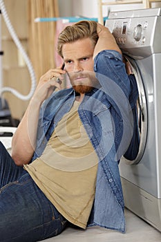 man does washing in washing machine