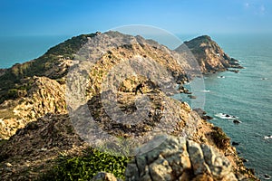 A Man Does Yoga on Mountains by The Ocean at Eo Gio in The Morning Sunshine photo