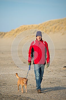 Man with dog at the beach