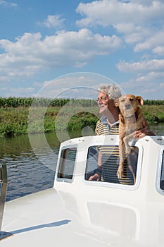 Man and dog in boat