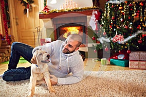 Man with dog enjoying for Christmas holiday