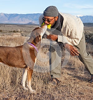 Man and a dog playing