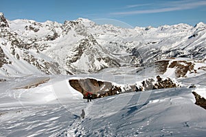 Man and dog running in devero mountain photo