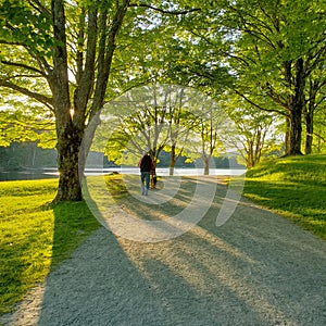 Man with Dog Walking Around Bass Lake in NC