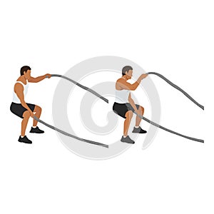 Man doing battle rope squatting alternating waves