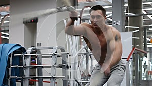 Man doing battling rope exercise at the gym