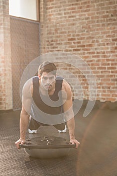 Man doing bosu push ups