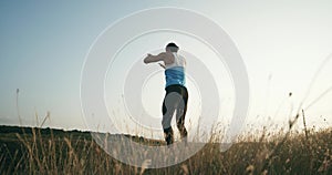 Man doing burpees exercise fitness workout outdoors. Slow motion