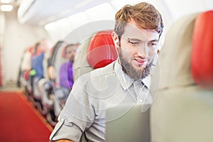 Man doing business in the airplane