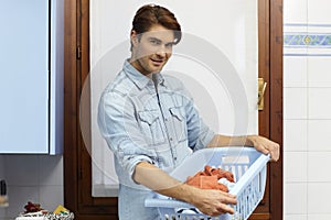 Man doing chores and washing clothes