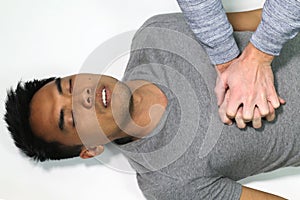 Man doing a CPR over a white background