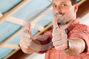 Man doing dry walling, working