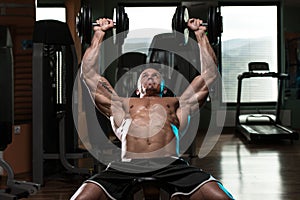 Man Doing Dumbbell Incline Bench Press Workout