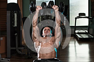 Man Doing Dumbbell Incline Bench Press Workout