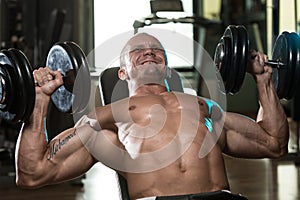 Man Doing Dumbbell Incline Bench Press Workout