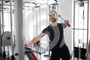 Man doing exercise on decompression simulator at rehabilitation center