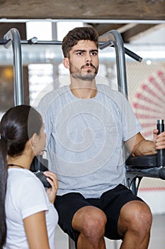 man doing exercise in gym