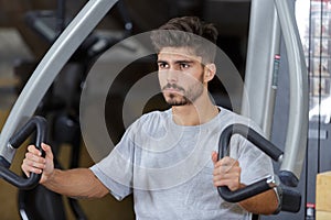 man doing exercise in gym