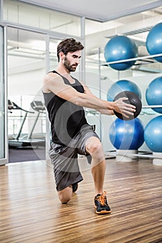 Man doing exercise with medicine ball