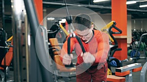 A man is doing an exercise to strengthen his arms