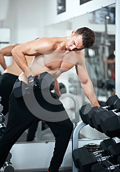 Man doing exercises dumbbell bicep muscles