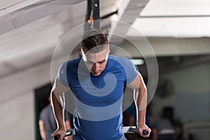 Man doing exercises parallel bars