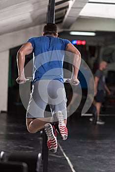 Man doing exercises parallel bars