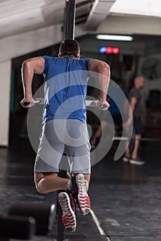 Man doing exercises parallel bars