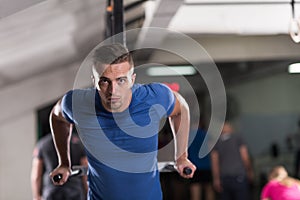 Man doing exercises parallel bars