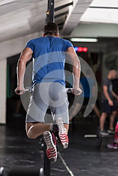 Man doing exercises parallel bars