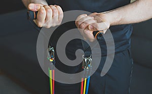Man doing exercises with resistance bands.