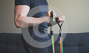 Man doing exercises with resistance bands.