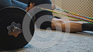 Man doing exercises with resistance bands at home.