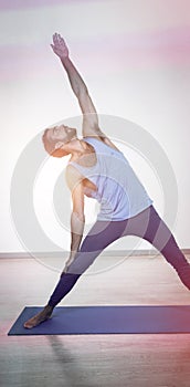 Man doing extended triangle pose