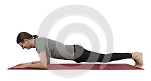 Man doing forearm plank pose in yoga