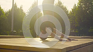 A man doing headstand in the park