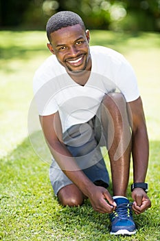 Man is doing his laces