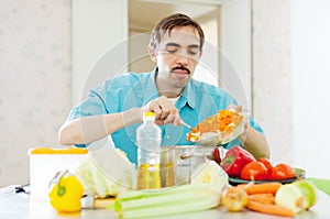 Man doing lunch with vegetables