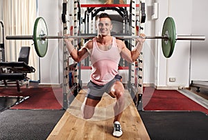 Man doing lunges with barbell
