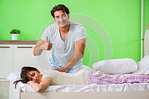 The man doing massage to his wife in bedroom